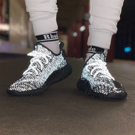 yeezy black reflective stockx